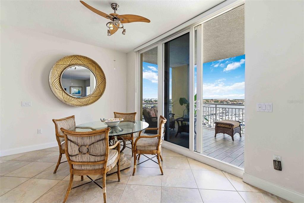 606 Riviera Dunes Way, Unit 601 Palmetto, FL 34221 - Photo 28 of 70 a dining room with furniture and a window