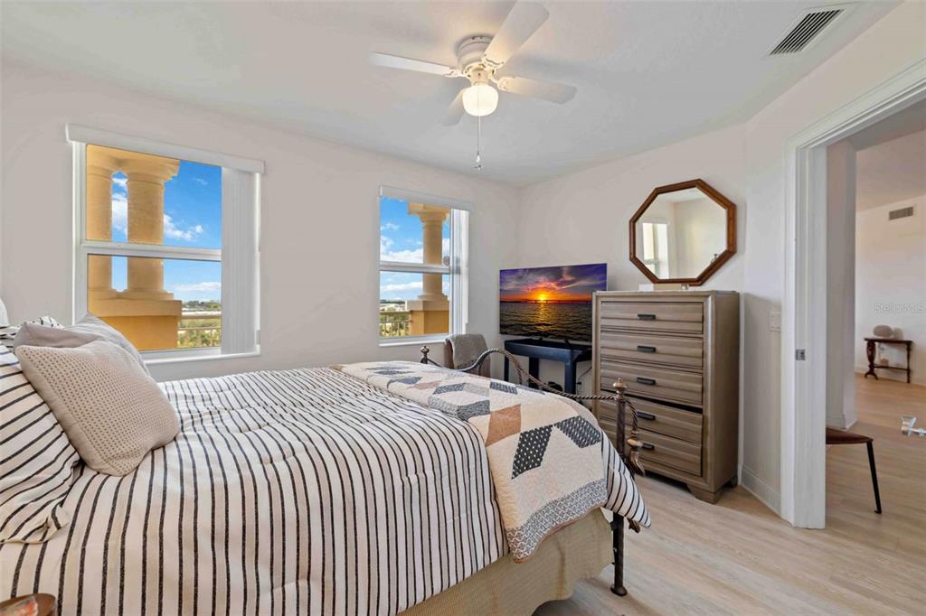 606 Riviera Dunes Way, Unit 601 Palmetto, FL 34221 - Photo 35 of 70 a bedroom with a bed dresser and a window