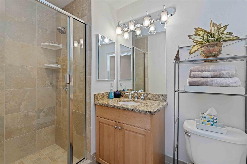 606 Riviera Dunes Way, Unit 601 Palmetto, FL 34221 - Photo 36 of 70 a bathroom with a sink a toilet and a mirror