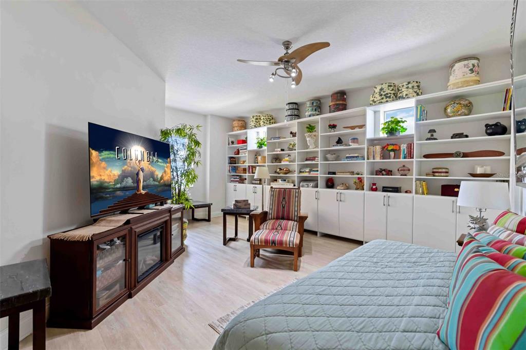 606 Riviera Dunes Way, Unit 601 Palmetto, FL 34221 - Photo 37 of 70 a living room with furniture and a flat screen tv