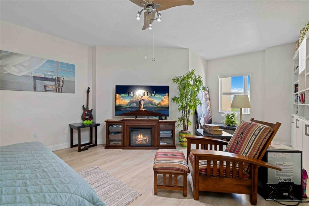606 Riviera Dunes Way, Unit 601 Palmetto, FL 34221 - Photo 38 of 70 a living room with furniture and a flat screen tv