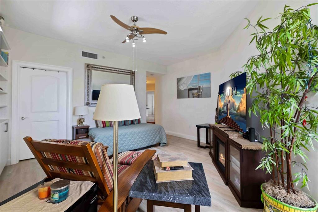 606 Riviera Dunes Way, Unit 601 Palmetto, FL 34221 - Photo 39 of 70 a living room with furniture and a flat screen tv