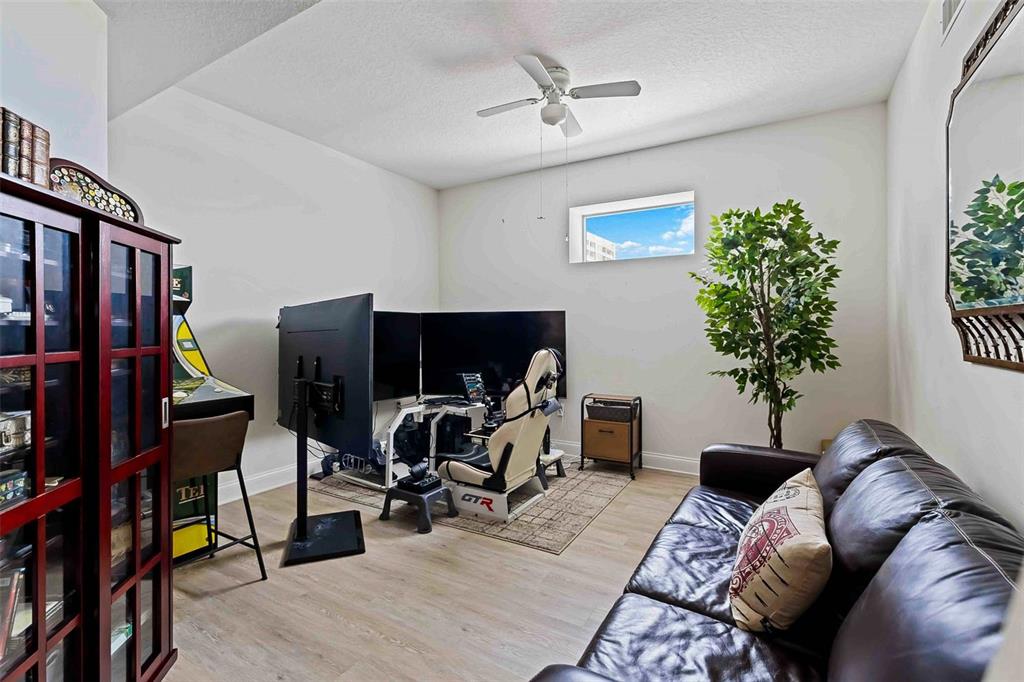 606 Riviera Dunes Way, Unit 601 Palmetto, FL 34221 - Photo 40 of 70 a view of a livingroom with workspace and a couch