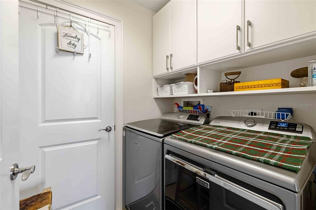 606 Riviera Dunes Way, Unit 601 Palmetto, FL 34221 - Photo 42 of 70 a kitchen with stainless steel appliances granite countertop a sink and cabinets