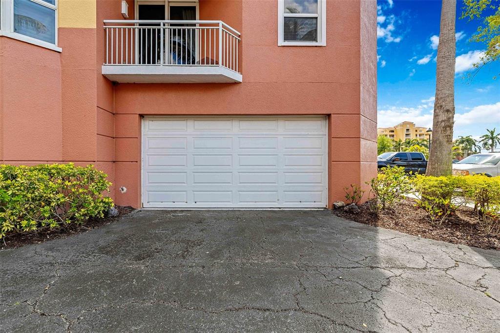 606 Riviera Dunes Way, Unit 601 Palmetto, FL 34221 - Photo 47 of 70 a front view of a house with plants