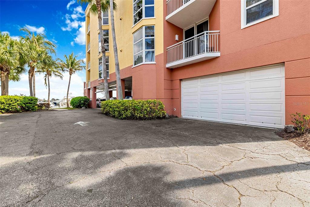 606 Riviera Dunes Way, Unit 601 Palmetto, FL 34221 - Photo 48 of 70 a view of a parking space in front of a building