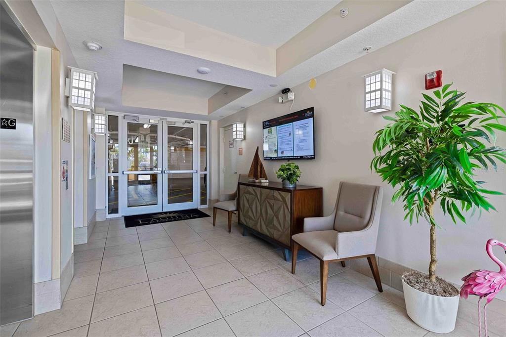 606 Riviera Dunes Way, Unit 601 Palmetto, FL 34221 - Photo 9 of 70 a living room with furniture and a potted plant