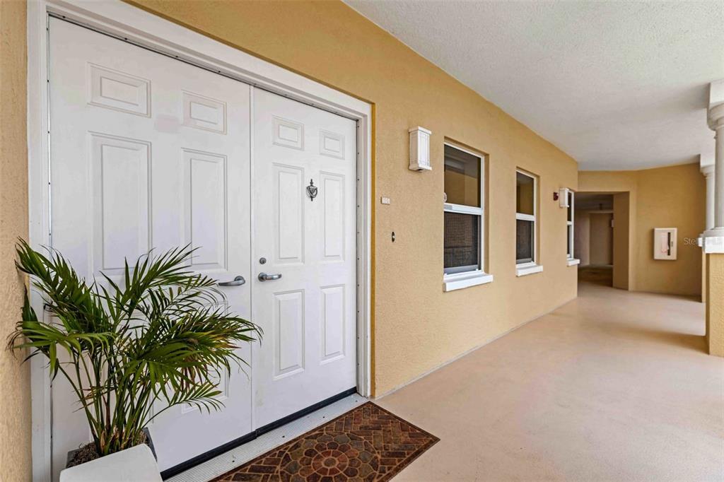 606 Riviera Dunes Way, Unit 601 Palmetto, FL 34221 - Photo 10 of 70 a view of livingroom with entryway and wooden floor