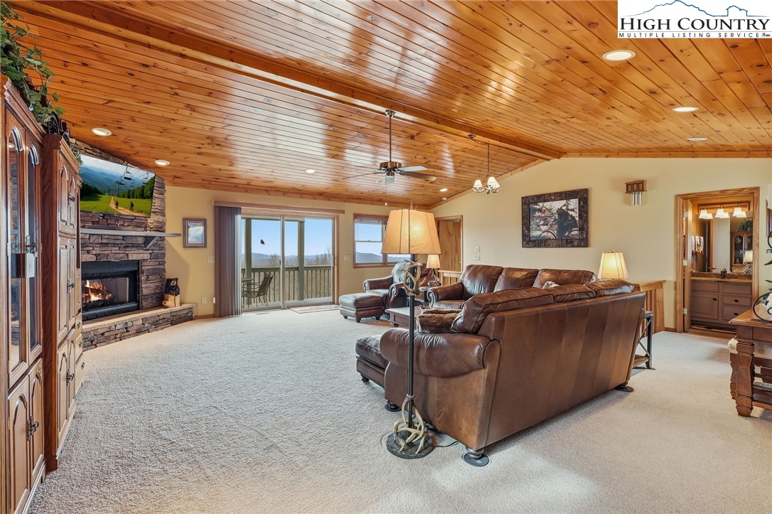112 North Pinnacle Ridge Road Beech Mountain, NC 28604 - Photo 10 of 40 a living room with furniture and a large window