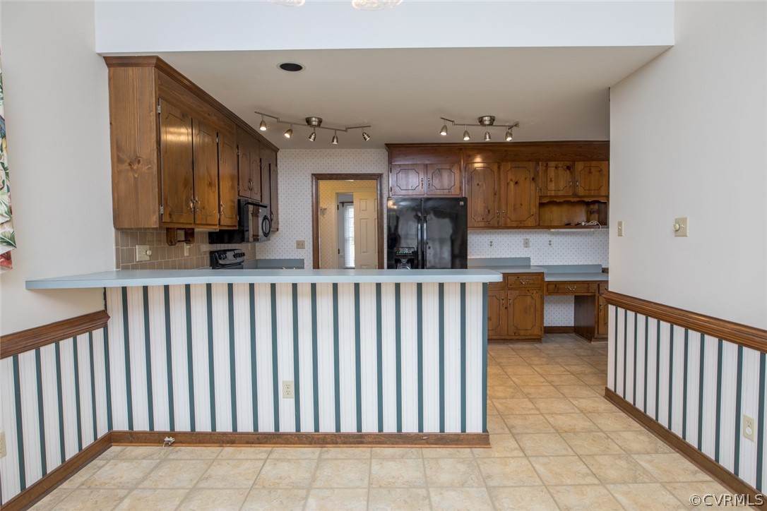 4624 Laurel Spring Court Chester, VA 23831 - Photo 11 of 31 a kitchen with stainless steel appliances kitchen island granite countertop a sink and cabinets