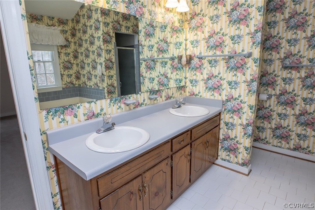 4624 Laurel Spring Court Chester, VA 23831 - Photo 20 of 31 a bathroom with a sink and a mirror