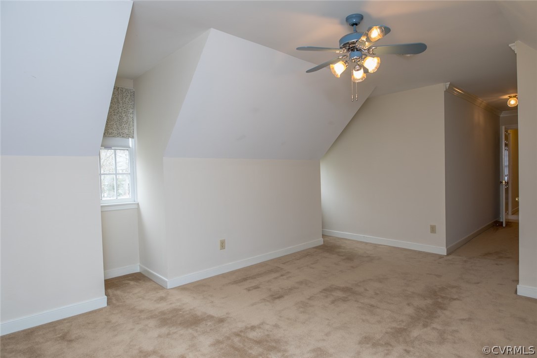 4624 Laurel Spring Court Chester, VA 23831 - Photo 23 of 31 an empty room with a chandelier fan and windows