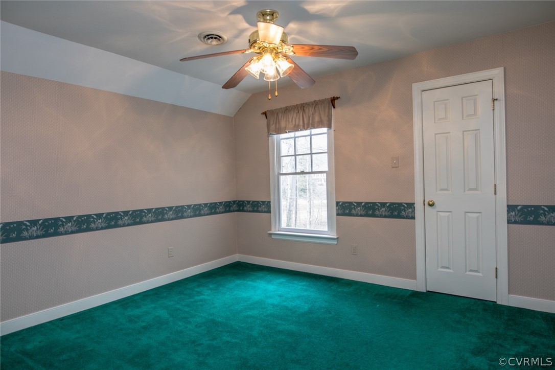 4624 Laurel Spring Court Chester, VA 23831 - Photo 24 of 31 a view of an empty room with window and chandelier fan