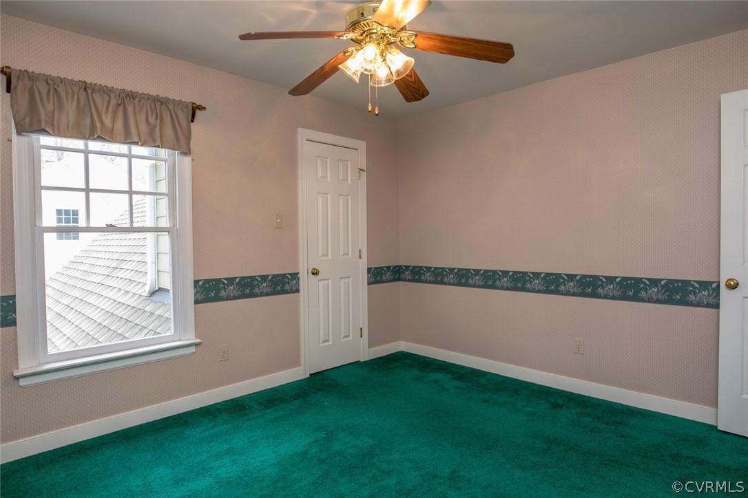 4624 Laurel Spring Court Chester, VA 23831 - Photo 25 of 31 a view of an empty room with window and chandelier fan