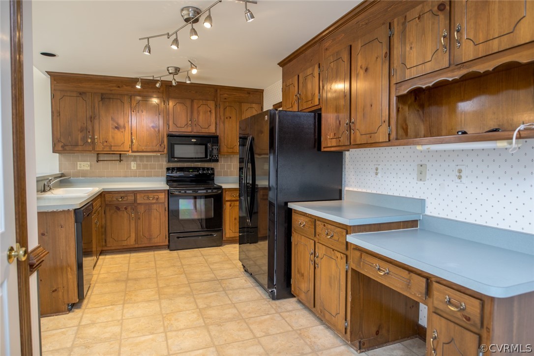 4624 Laurel Spring Court Chester, VA 23831 - Photo 7 of 31 a kitchen with kitchen island granite countertop a stove refrigerator and cabinets