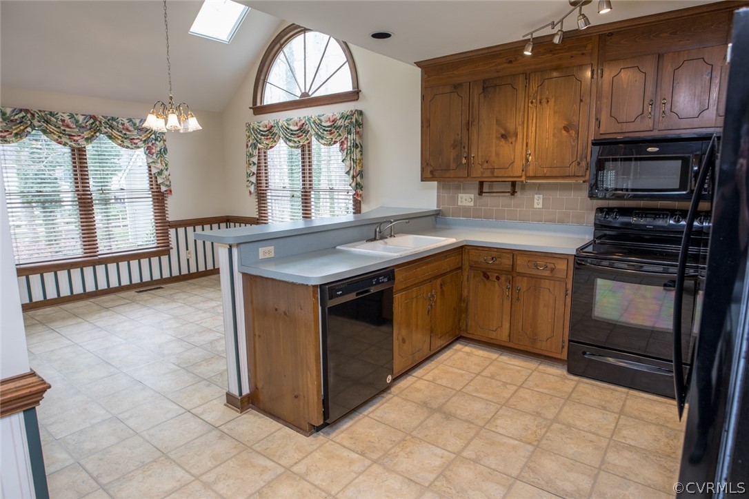 4624 Laurel Spring Court Chester, VA 23831 - Photo 9 of 31 a kitchen with stainless steel appliances granite countertop a stove a sink and a microwave