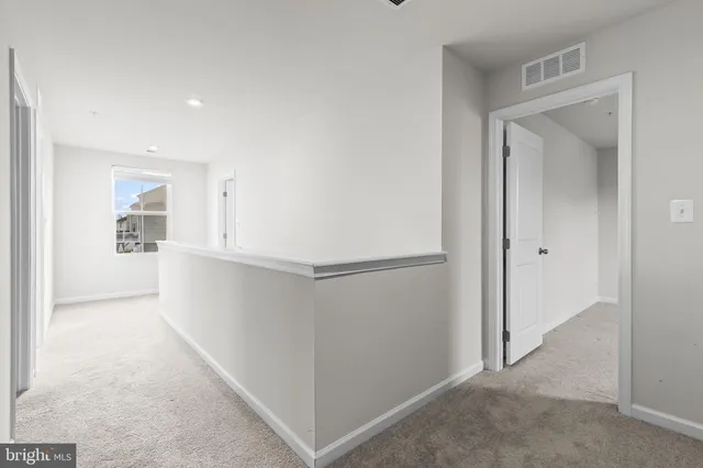 a balcony with wooden floor and trees