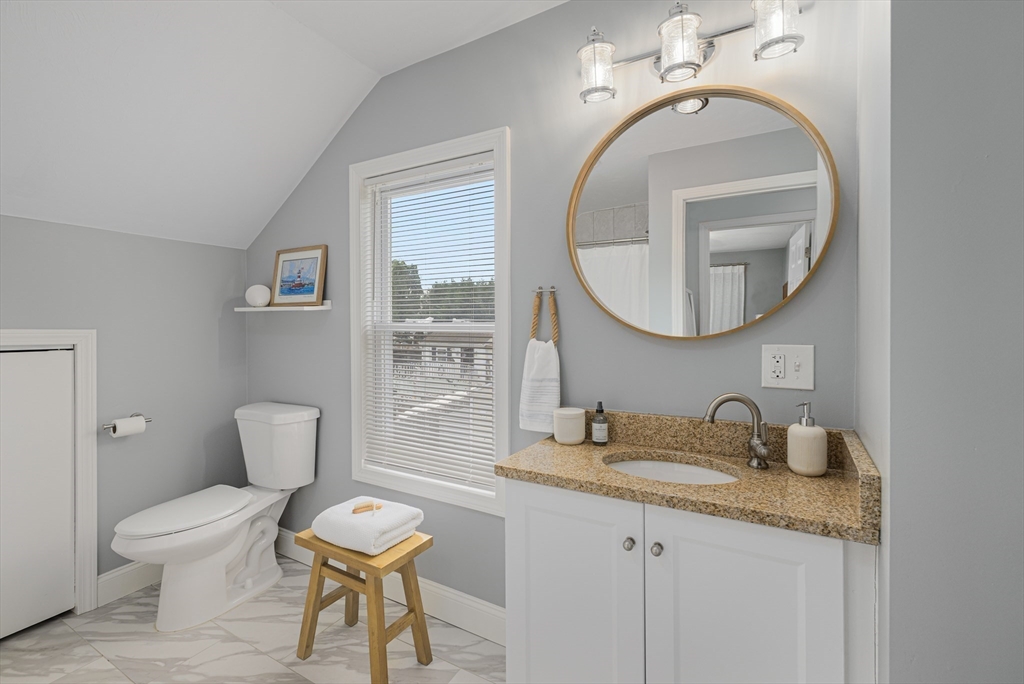 69 Denver Street Fall River, MA 02721 - Photo 30 of 35 a bathroom with a toilet a sink and mirror