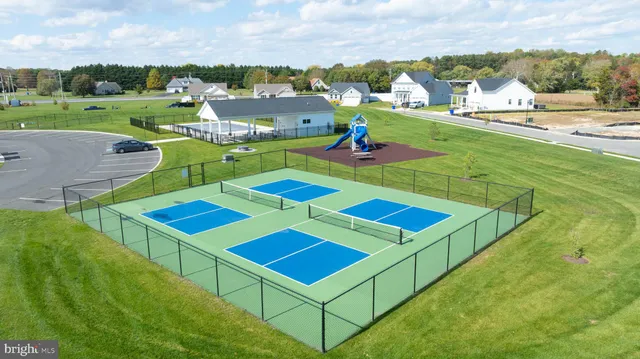a view of yard tennis and an houses