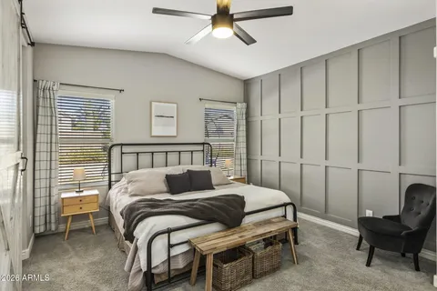 a bedroom with a bed and a dresser