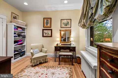 a spacious bedroom with a bed and a couch