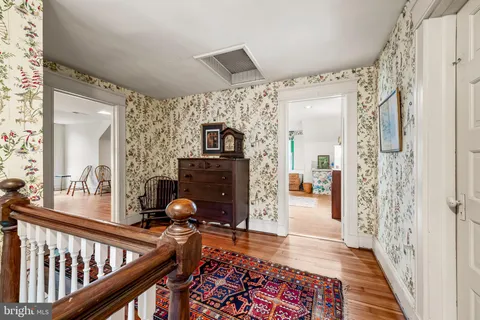 a bedroom with two beds and a couch
