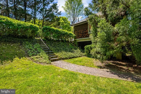 a view of yard with swimming pool and green space