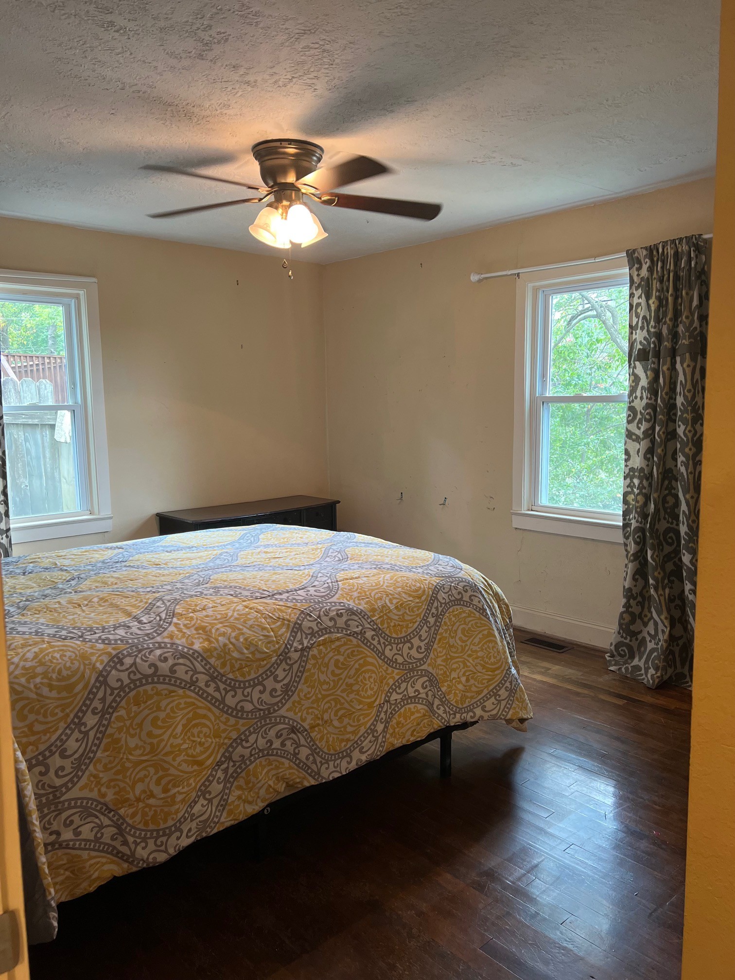 208 North Garner Street Springfield, TN 37172 - Photo 8 of 13 a bedroom with a bed and a window