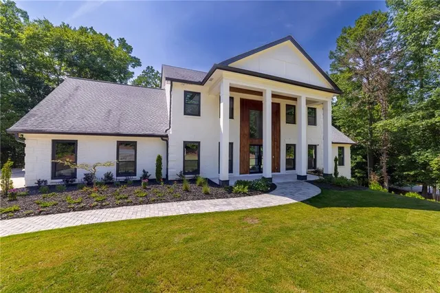 a front view of a house with garden