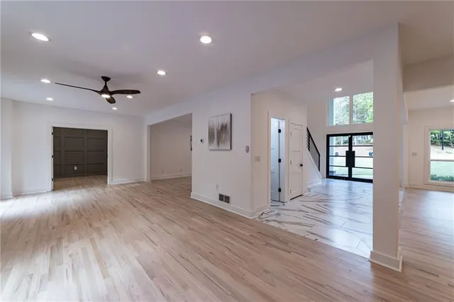 a view of a space with a wooden fence