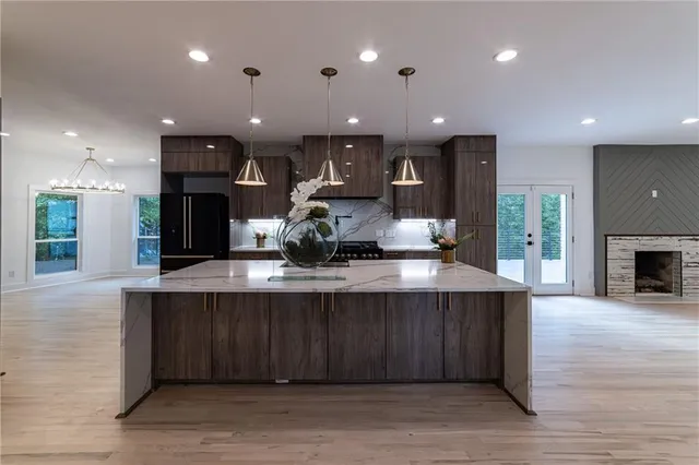 a view of a kitchen with furniture and a fireplace