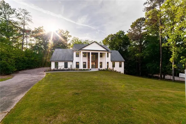 a front view of a house with a yard