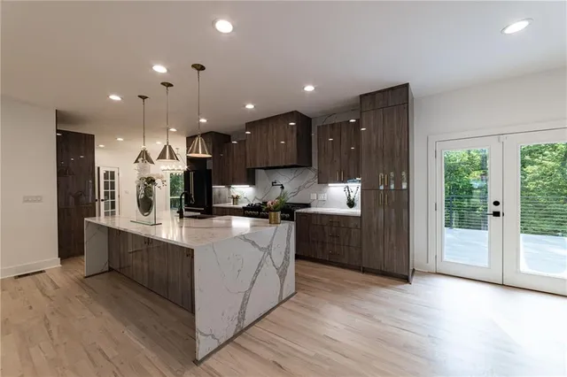 a bathroom with mirror and sink