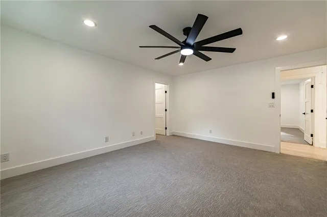 a en suite bathroom with a sink a mirror and shower