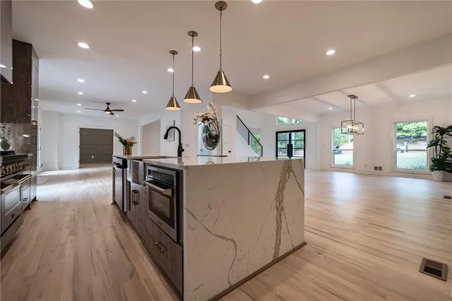 a kitchen with a sink and stove
