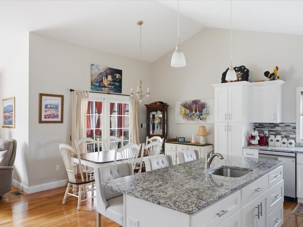67 Ling Street Fall River, MA 02720 - Photo 12 of 32 a kitchen with granite countertop a table and chairs