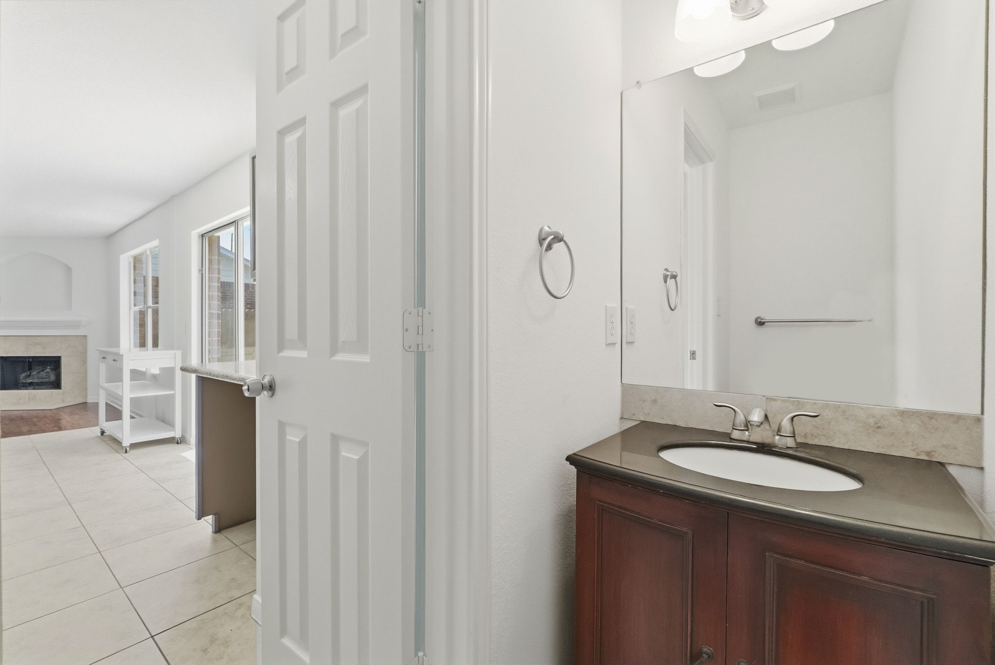 11907 Ezekiel Road Tomball, TX 77375 - Photo 18 of 39 a bathroom with a granite countertop sink and a mirror