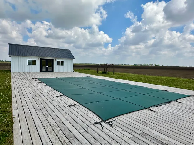 a view of swimming pool with lounge chair