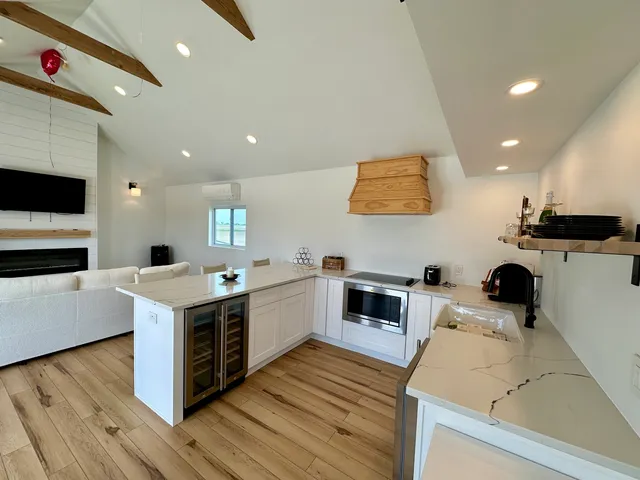a kitchen with a stove and a refrigerator