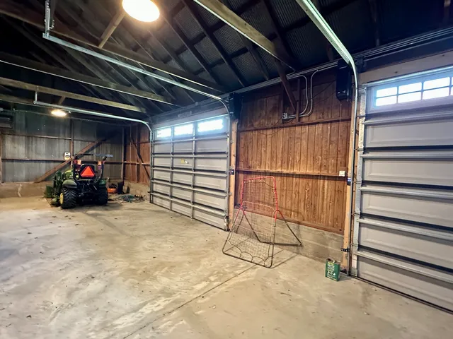 a view of a garage with a table and chairs