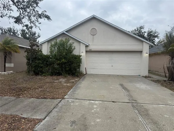 a front view of house with garage