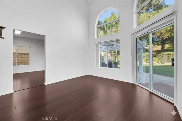 a view of an entryway with wooden floor