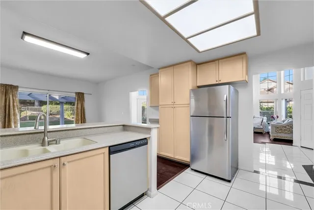 a kitchen with a sink a refrigerator and a sink