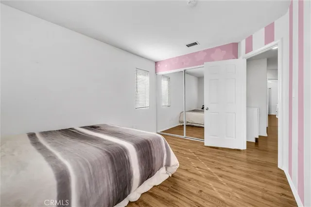 a bedroom with a bed and a desk