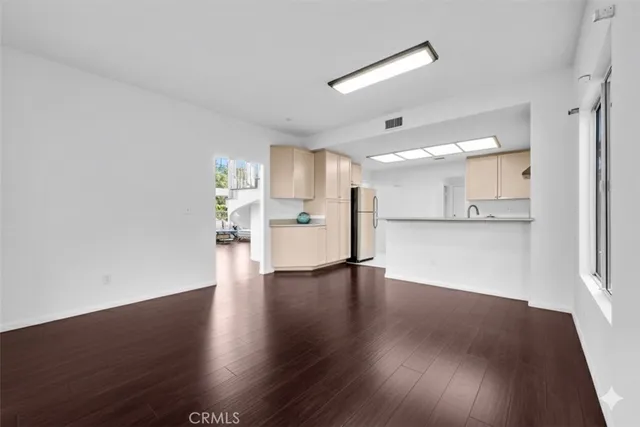 a view of a kitchen with a dishwasher and a refrigerator