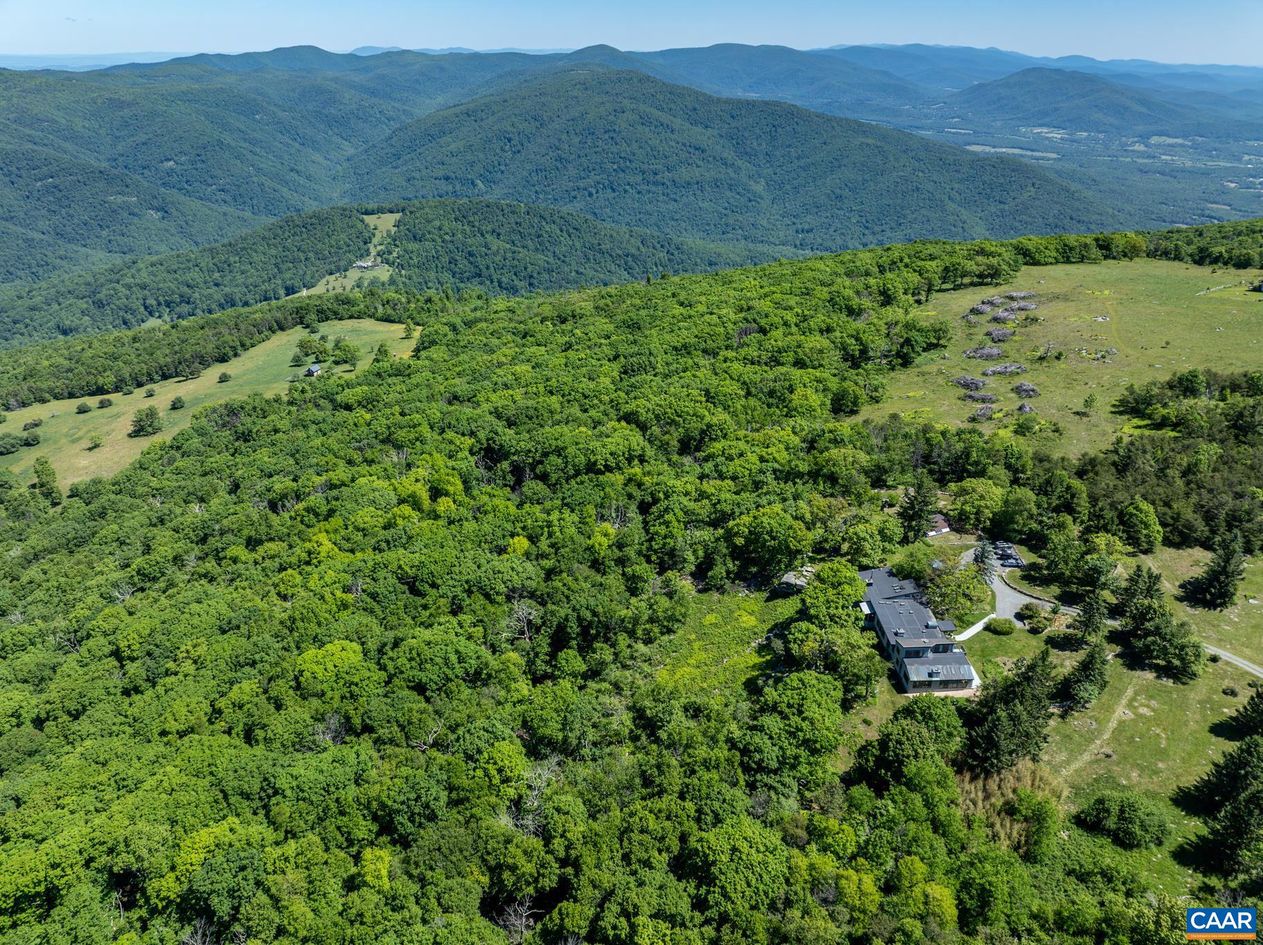 7098 Bucks Elbow Mountain Road Crozet, VA 22932 - Photo 54 of 57 a view of a lush green hillside and houses