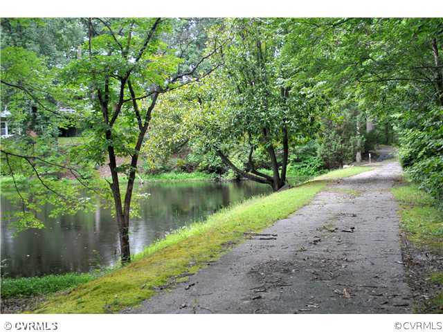 13130 Harrowgate Road Chester, VA 23831 - Photo 5 of 10 a view of a lake with a yard