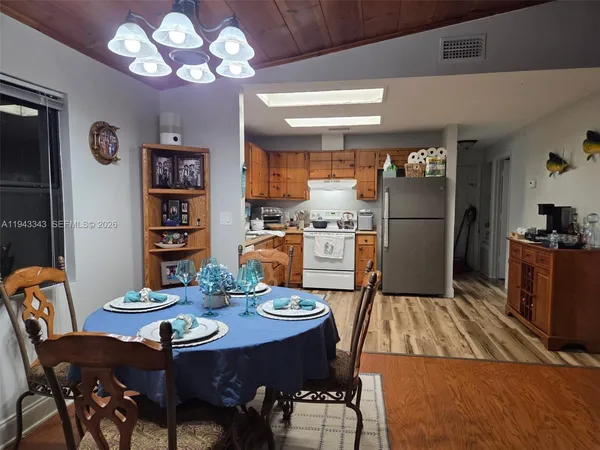 a view of a dining room with furniture
