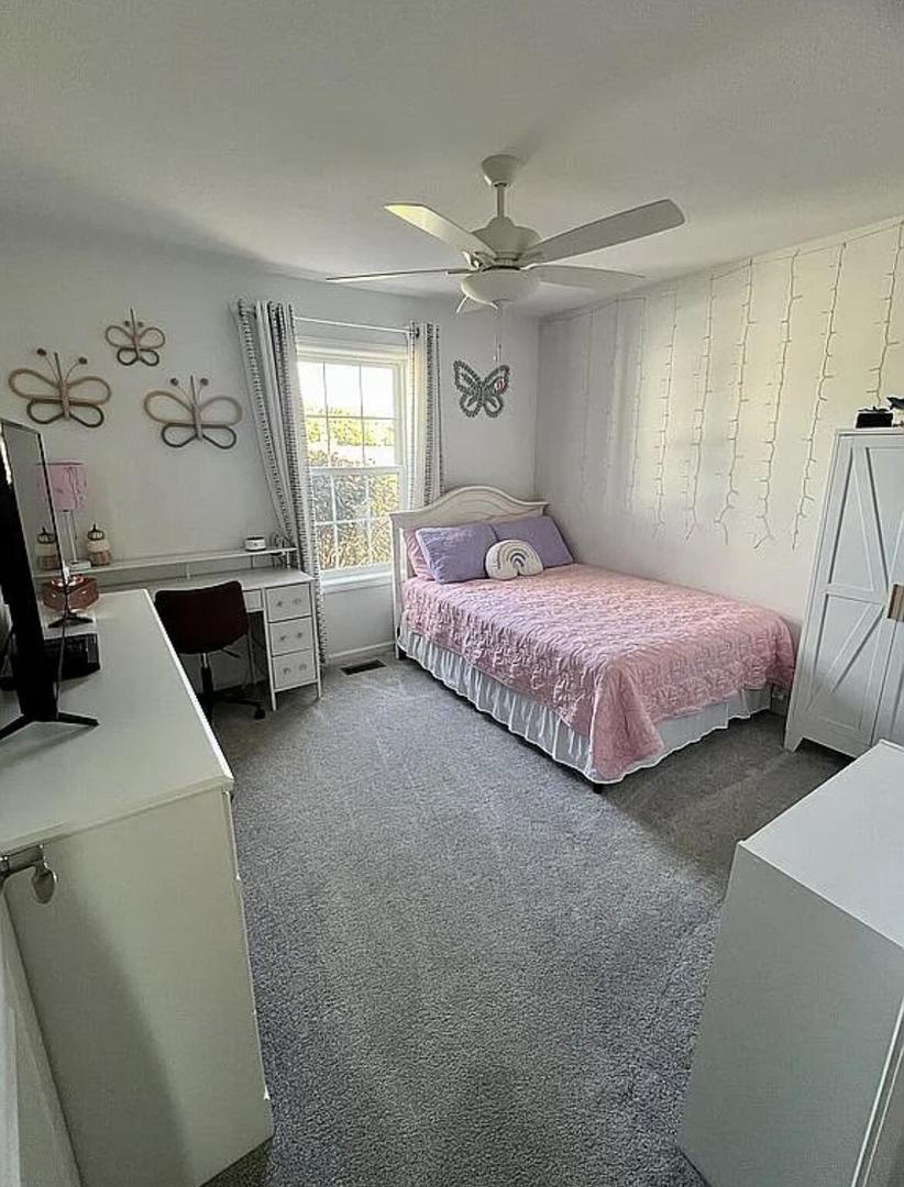 6227 East Sarver Lane Argenta, IL 62501 - Photo 11 of 20 a spacious bedroom with a bed and wooden floor