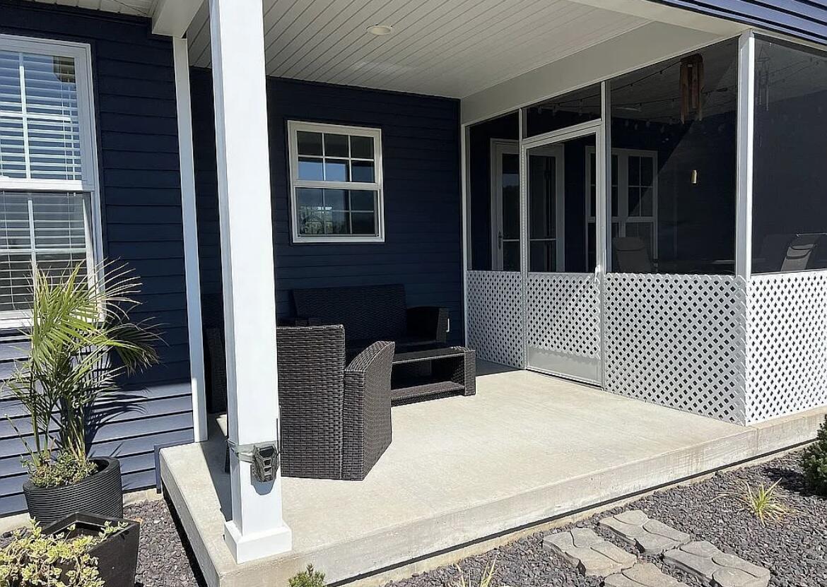 6227 East Sarver Lane Argenta, IL 62501 - Photo 17 of 20 a side view of a house with a large window